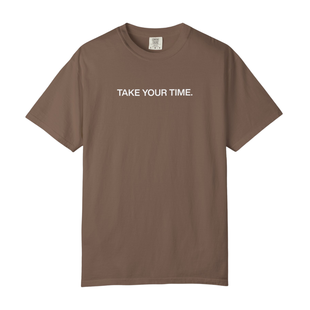 Brown t-shirt with 'TAKE YOUR TIME.' text on a white background