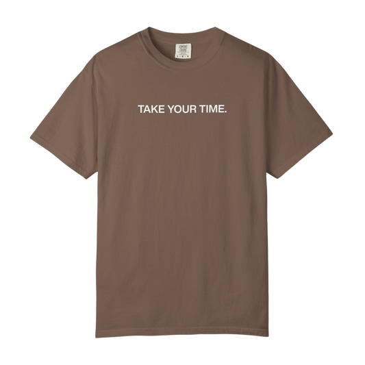 Brown t-shirt with 'TAKE YOUR TIME.' text on a white background